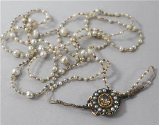 A Regency seed pearl necklace with gem set clasp, 70cm.